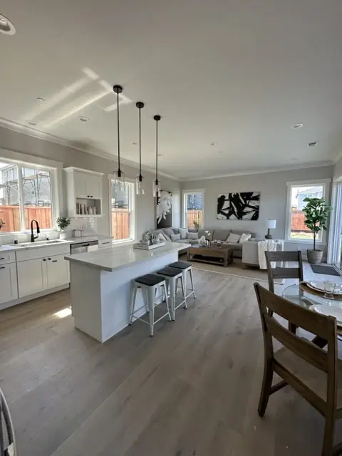 Open plan kitchen and living space with pendant lights